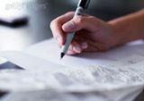 Image of someone writing