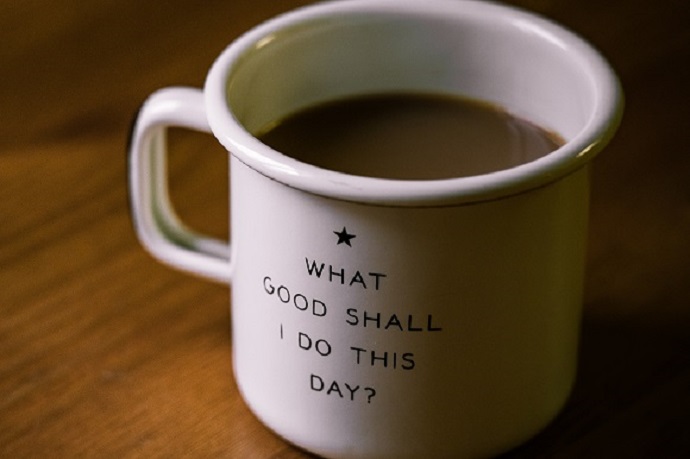 Coffee cup with the words "What good shall I do this day?"