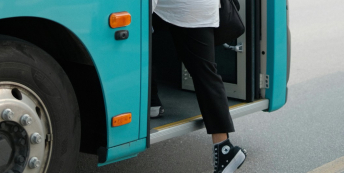Image of someone boarding a bus
