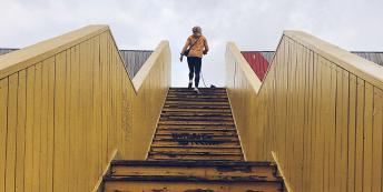 Woman at top of staircase 