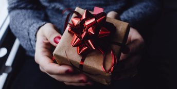 Image of someone holding a gift