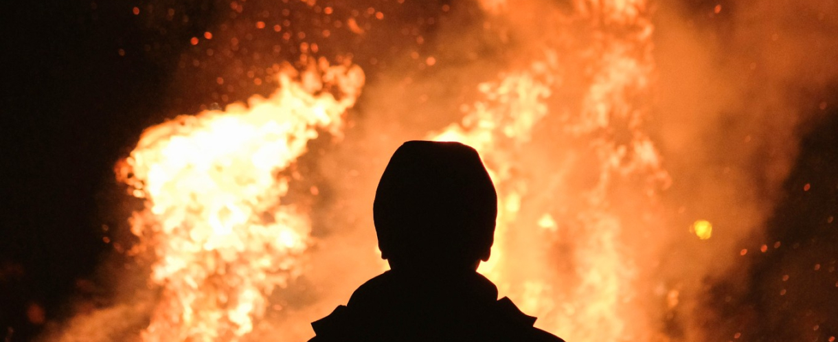 Image of someone looking at a fire