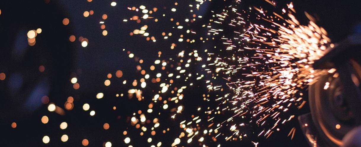 Image of sparks flying from grinder at night