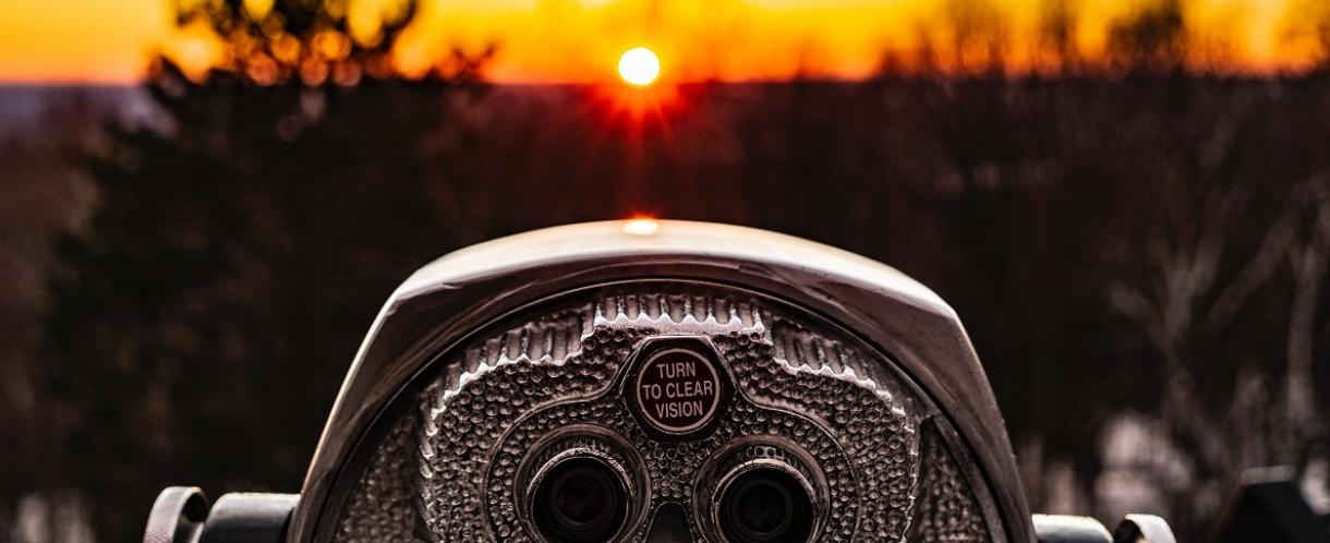 Image of binoculars at sunset