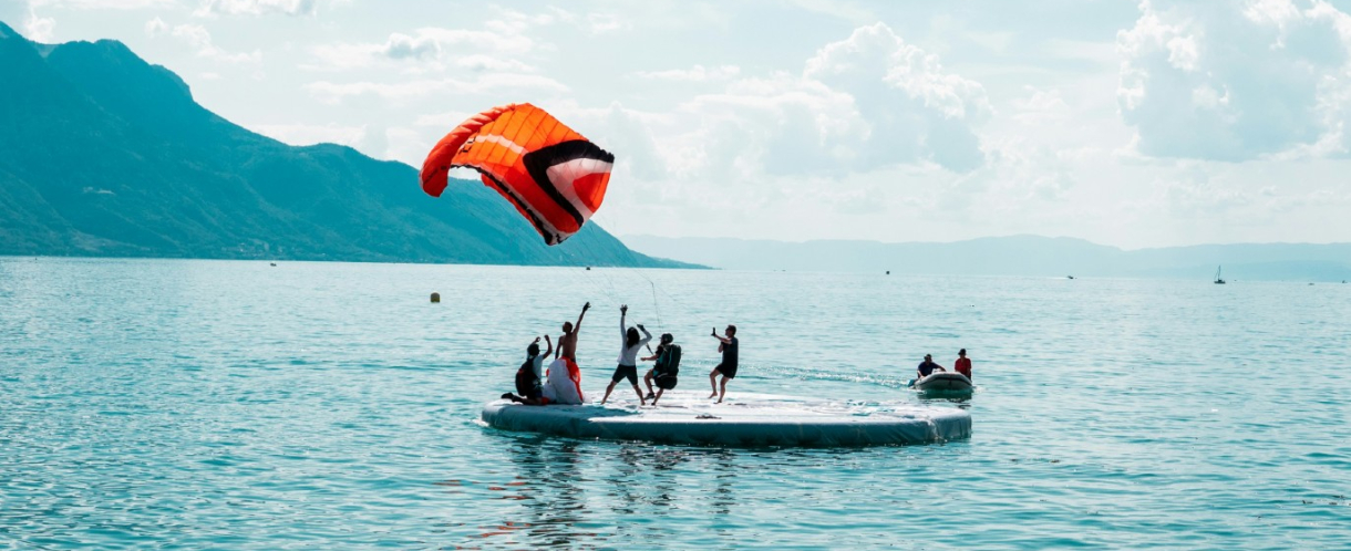 Image of a group of people launching a large kite 
